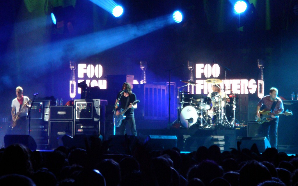 Foo Fighters performing in November 2007. From left to right: Chris Shiflett, Dave Grohl, Taylor Hawkins and Nate Mendel. photo by mojo-jo-jo.