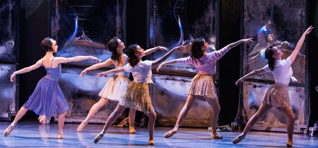 Lise (Sarah Esty), far left, auditions for the ballet in front of the large mirrors.