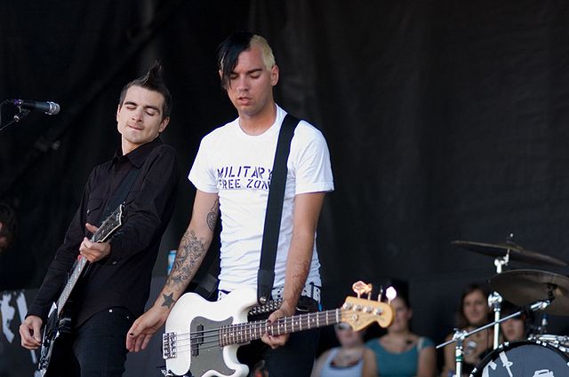 Justin Sane and Chris #2 of Anti-Flag jam together at the 2006 Vans warped tour. photo: returnofburno and Wikipedia.