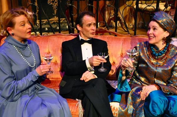 Whereas the London revival of ‘Blithe Spirit’ has Angela Lansbury as Madame Arcati, here Mary Rawson (in the turban) plays theater’s happiest medium with more than ample gusto. The skeptical guests are Mrs. Bradman and her hubby (Lissa Brennan and James FitzGerald). 