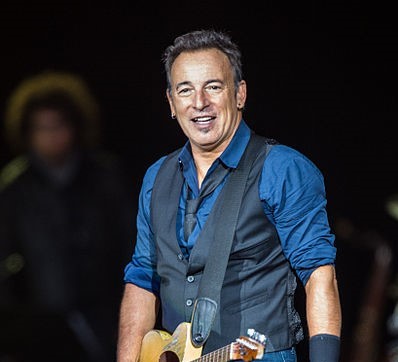 Bruce Springsteen with Guitar. Photo: Bill Ebbesen and Wikipedia.