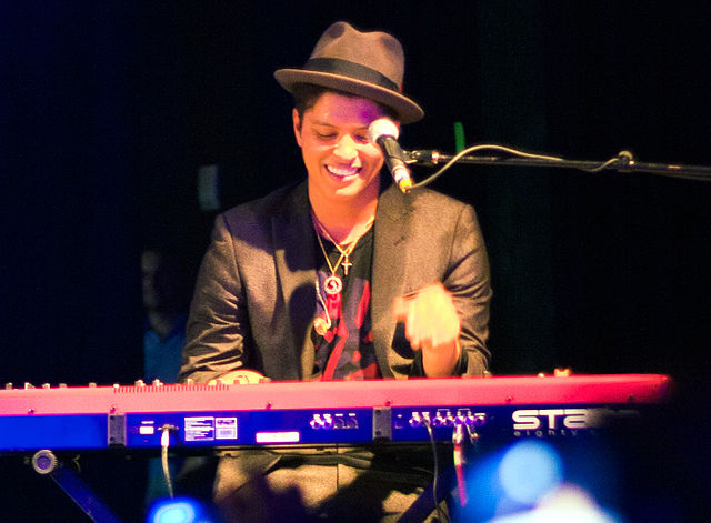 Bruno Mars playing keyboards at a Houston concert in 2010. Photo: Brothers Le and Wikipedia.