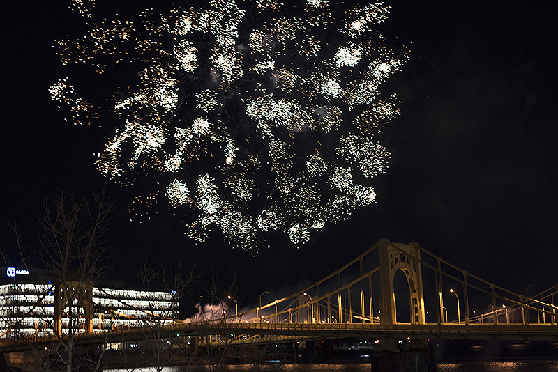 The Dollar Bank Children's Fireworks go off over the Andy Warhol Bridge as First Night gets under way.