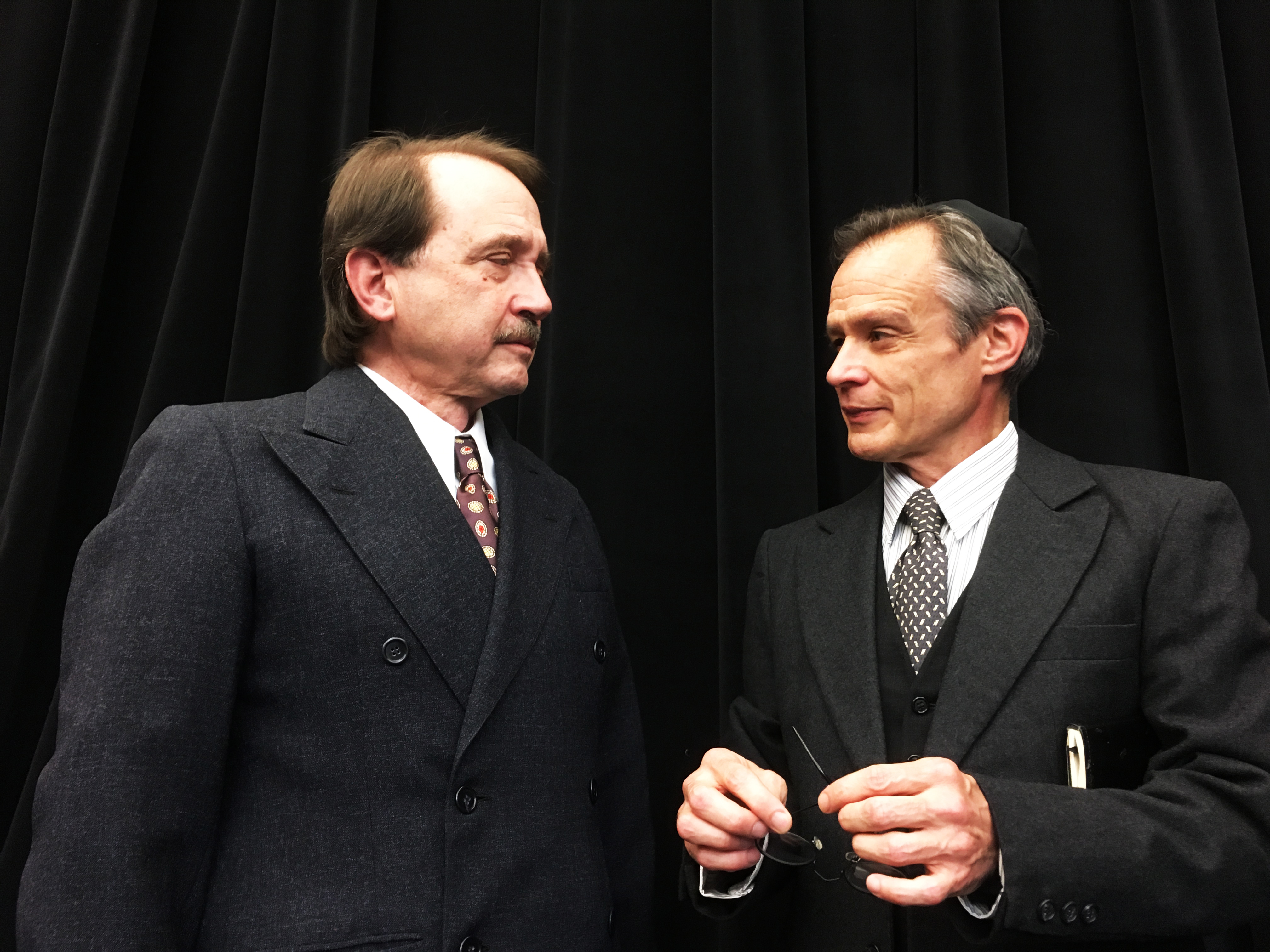Antonio (Martin Giles, L) and Shylock (James FitzGerald) have a business relationship. Not shown: the monkey business that unfolds around them, and the ugly business that will soon erupt.