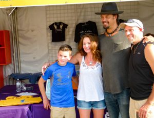 Michael Franti poses with some fans for a photo before the concert.