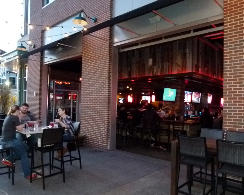 You don't have to be a cowboy or cowgirl to have fun at Tequila Cowboy. Several folks are enjoying the outdoor patio, while others congregate at the bar inside.