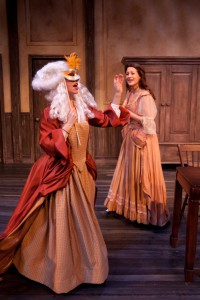 In off the WALL's "Or," Lady Davenant (Robin Abramson, masked) pays an unexpected—and amusing—visit to Aphra Behn (Erika Cuenca).