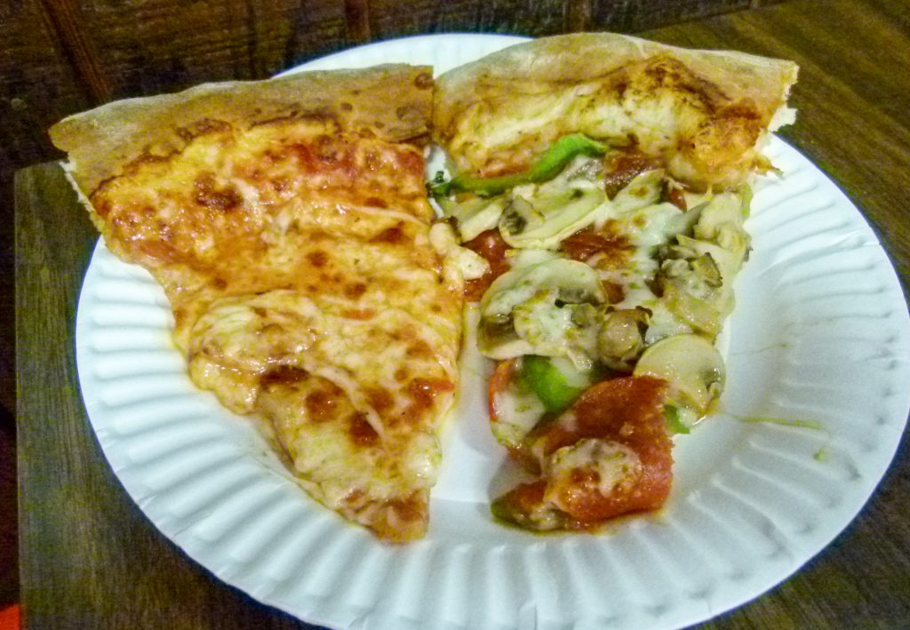 One slice plain, one slice with pepperoni, mushroom, and green peppers.