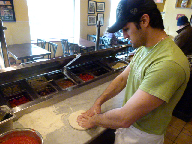 Spreading the dough.