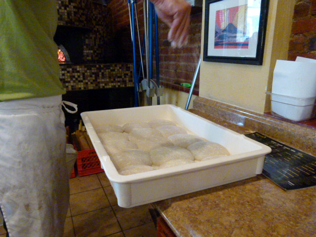 Prepping the dough with a light sprinkle of flour.