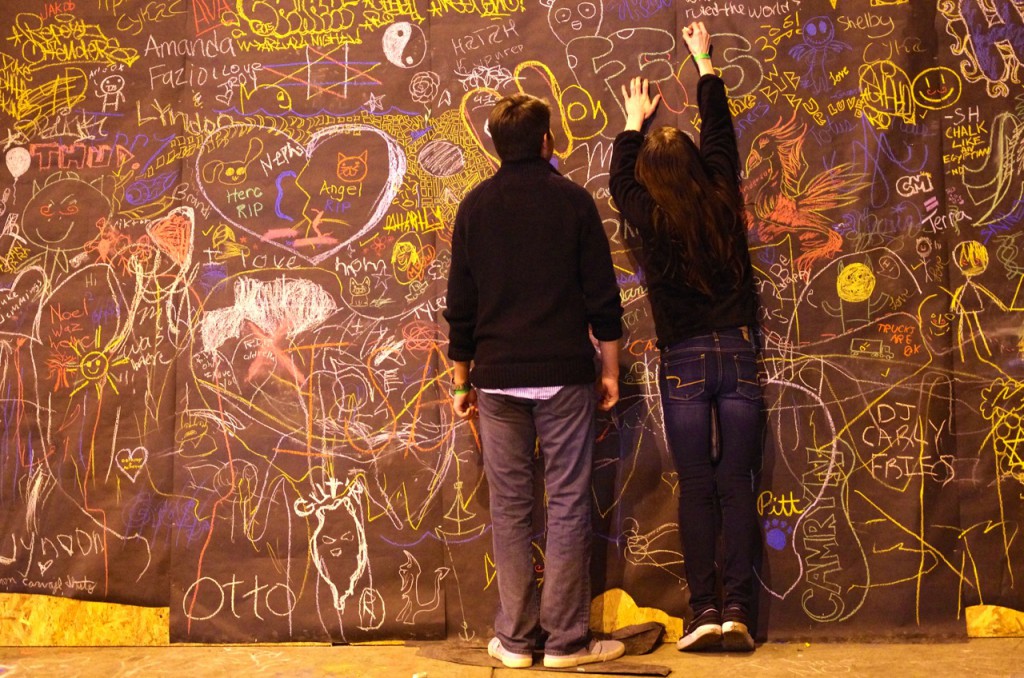 Visitors make their mark on the event with chalk.