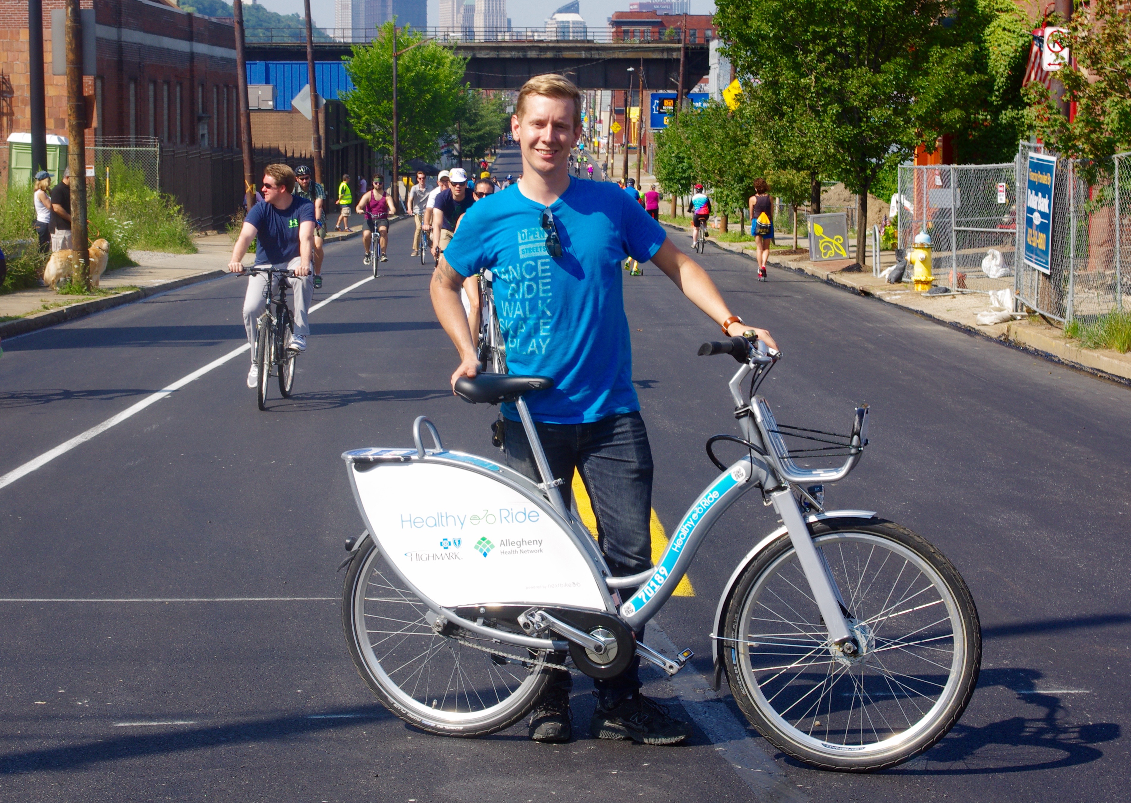 Mike Carroll, event manager for BikePGH, kept an eye on activities while riding a Healthy Ride bike share bicycle.