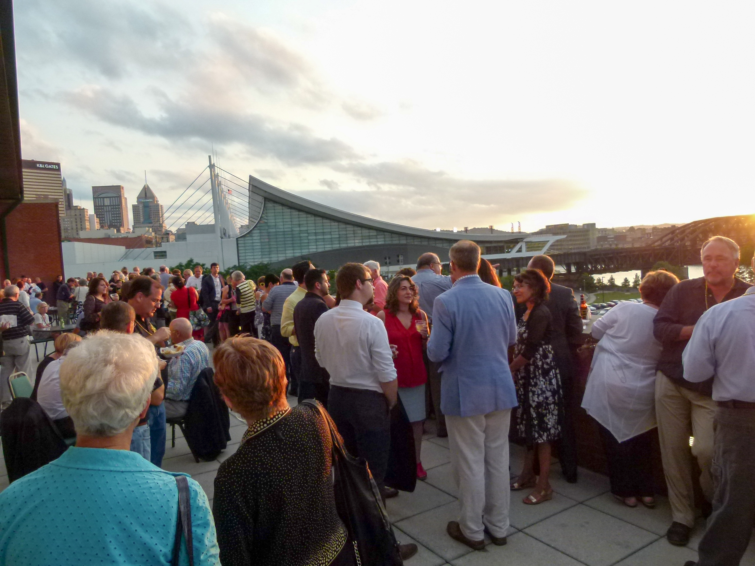 Attendees enjoying a Pittsburgh sunset on the fifth floor deck.