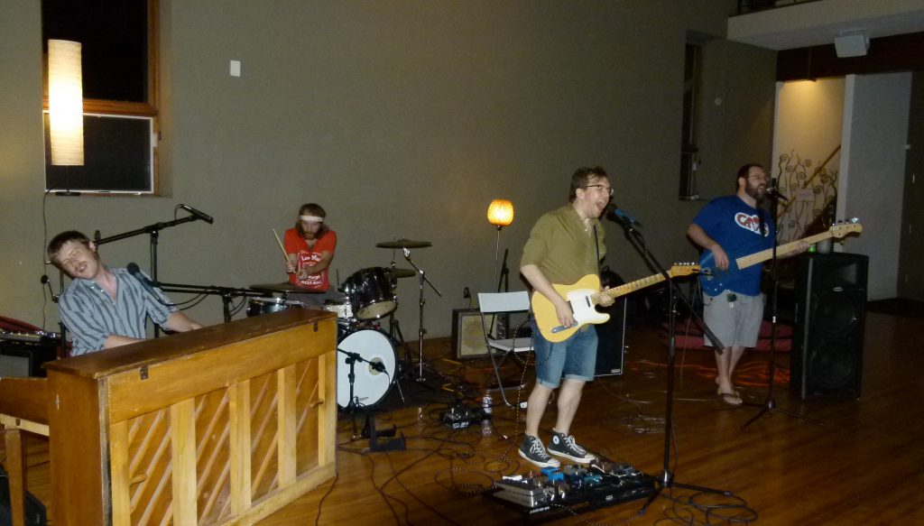 The Wreck Loose let's loose on a rock song. Max Somerville (l. to r.) Derek Krystek, Nathan Zoob, and Dave Busch .