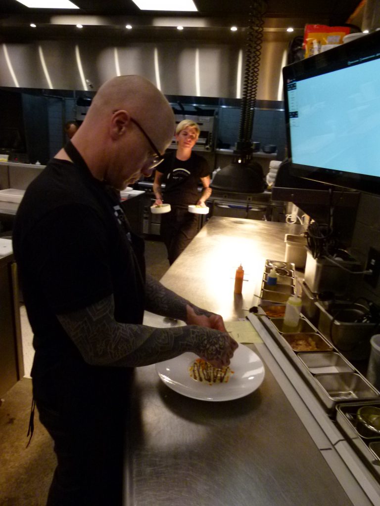Chef Sousa puts the finishing touches on the crab appetizer.