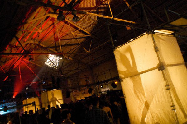 Dancers do their routines in several different light boxes across the warehouse party floor. photo: Jonathan Greene