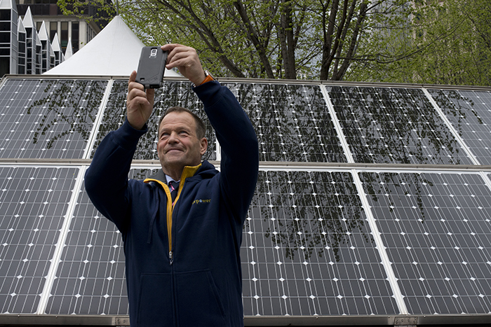 Robert Swan snaps a selfie with the solar panels on display at the EverPower Earth Day Festival. Swan, an advocate for renewable energy and the protection of Antarctica, is the first person to walk to the North and South Poles.