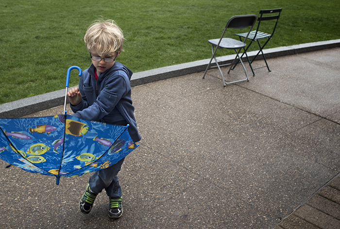 IIra Clemens, age 5, has a fish umbrella and he knows how to use it at the 422 Pop Up Dance Party on Schenley Plaza.