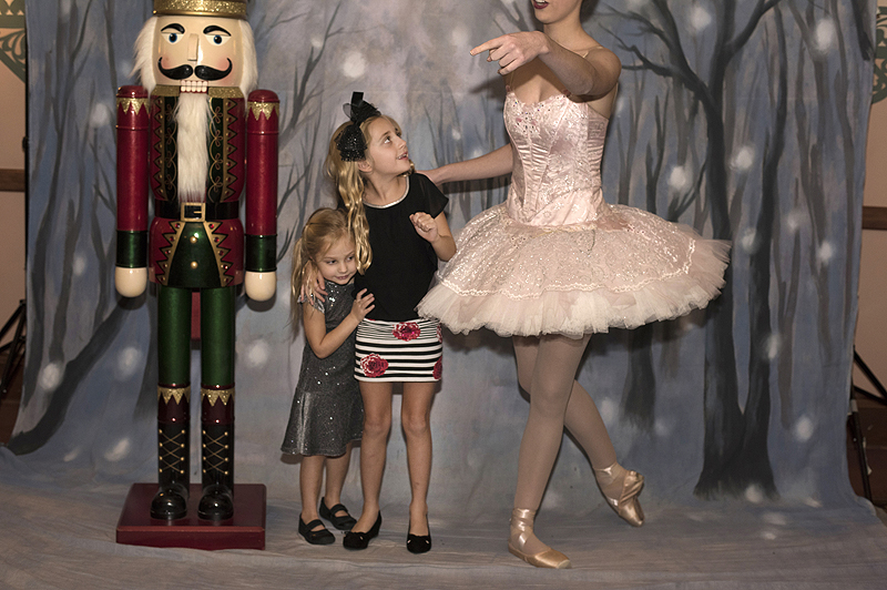 During intermission Scarlett Curtin, 4, and Gianna Curtin, 8, of South Fayette Township, pose with the Nutcracker and a Sugar Plum Fairy in the Benedum Center lobby.