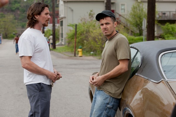 Although Christian Bale (L.) has received praise for his performance as Russell Baze, the character who is onscreen the most and ultimately carries the story, many consider Casey Affleck's (R.) work as the troubled and erratic Rodney to be best in the film.  