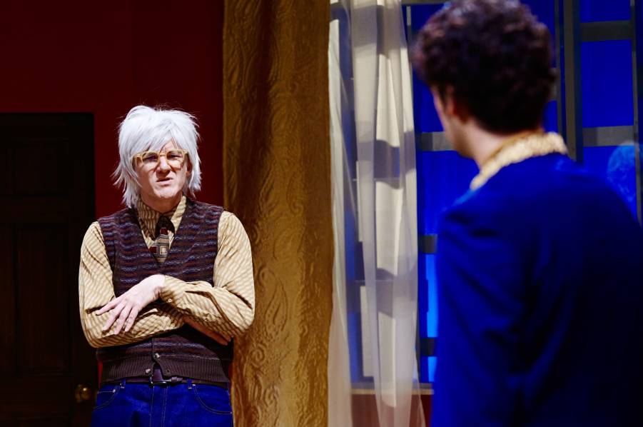 Andy Warhol (Jeffrey Emerson) nearly flips his fright wig when confronted by an ominous stranger.