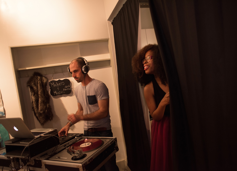 Fieldworks hosted a show called Makers & Music at Unblurred. Here, Tanisha Jackson (R) watches from backstage while DJ Illeso gets down to business.