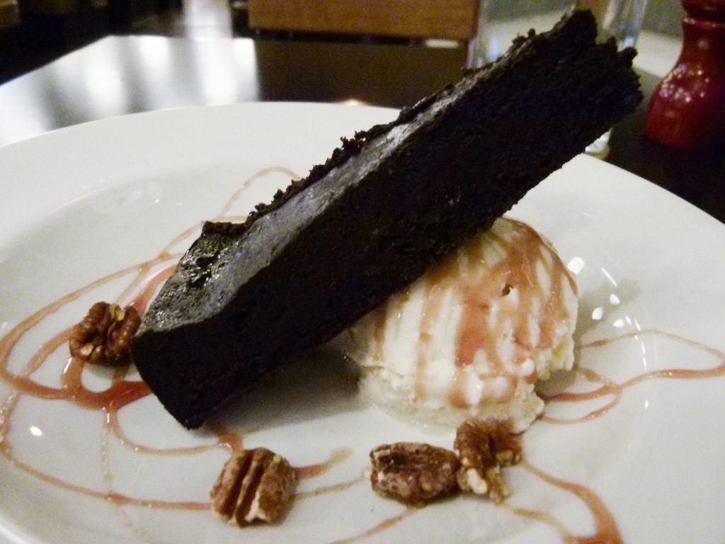 The flourless chocolate cake with vanilla ice cream, ready to rock your world.