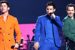 The Jonas Brothers performing on tour in 2019. (photo: musicharts and Wikipedia)