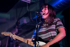Courtney Barnett performing at a concert in 2015. (photo: Paul Hudson and Wikipedia)