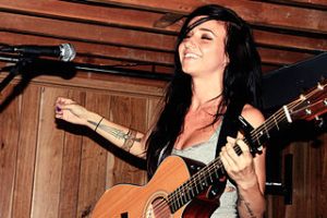 Lights (Valerie Poxleitner) performing an acoustic set in Toronto at Sonic Boom record store in 2010. Photo: Shandi-lee Cox and Wikipedia.
