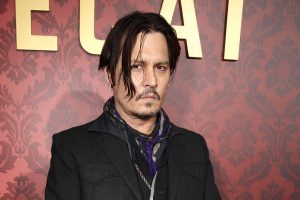 Depp looked as if handcuffed for a perp walk. But should he walk the plank for this offense?
