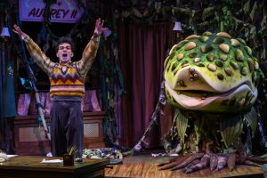Seymour (Philippe Arroyo) and the carnivorous plant Audrey II in The Public's 'Little Shop Of Horrors. (photo: Michael Henninger)