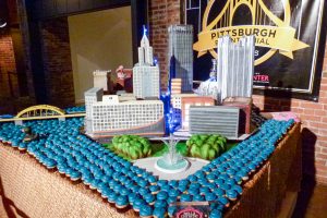 A beautiful cake of Pittsburgh. Notice the crystalline sugar "water" emerging from the fountain and the Heinz History Center with it's Heinz Ketchup bottle in the background.