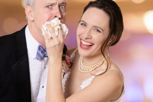 Baaad groom! Julia Geisler gives Tim McGeever a piece of her cake in CLO’s ‘Perfect Wedding.’
