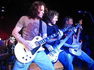 Winger jamming in a 2007 photo (l. to r.) John Roth, Kip Winger, and Reb Beach. photo: Rick Audet and Exxolon.