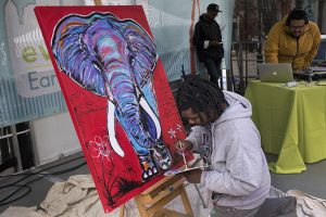 Baron Batch paints a mighty pachyderm while a DJ from the Pittsburgh collective Detour provides the beats. The painting was later auctioned to benefit Tree Pittsburgh.