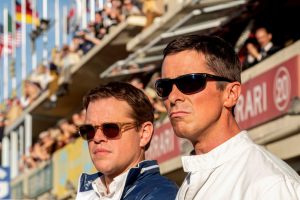 seen here driving the car to its max.|Matt Damon as racing legend and race car designer Carrol Shelby with his Cobra before a race at Willow Springs in California.|Shelby American and Ford engineers get feedback on the latest test run from Miles.|Caitriona Balfe and Christian Bale are Mr. and Mrs. Ken Miles in 'Ford v Ferrari.'