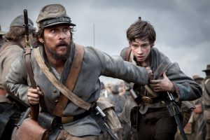 Newton Knight (Matthew McConaughey) guides Daniel (Jacob Lofland) through the ranks in 'The Free State of Jones.' photo: STX Entertainment.