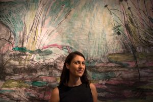 Artist Sarah Zeffiro with her mixed-media work "Wading" at Fieldwork Contemporary Gallery.