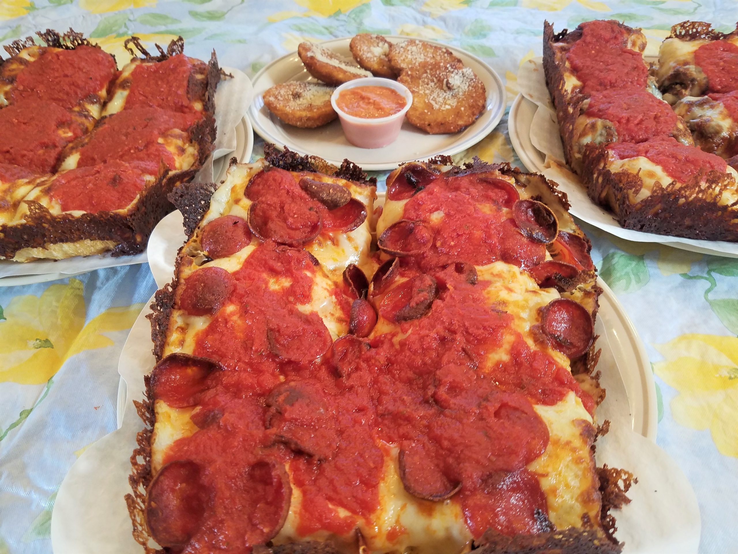 Driven PGH's pizzas: red top (l.), pepperoni (ctr.), The Traci (r.) and an order of fried ravioli and vodka sauce.
