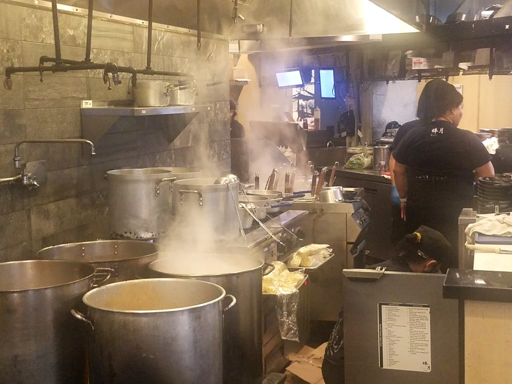 Many pots of ramen broth a-boiling.