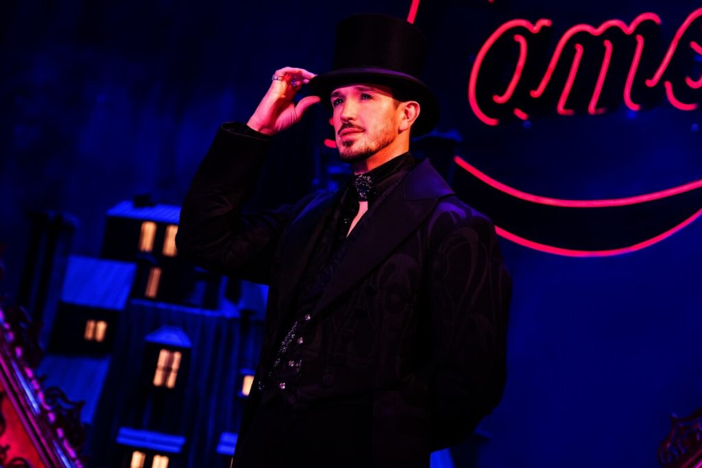 The Count (Andrew Brewer), lecherous and greedy, plots his seduction of Satine, the chanteuse of the Moulin Rouge.