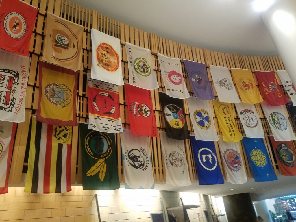 Flags of American Indian nations hang at the National Museum of the American Indian.