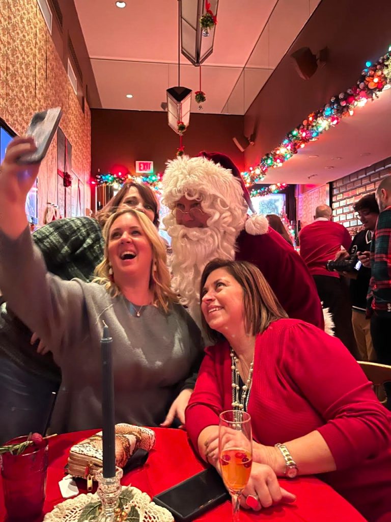Having some holiday fun are (Top, L. To R. : Lisa Nutter, Mr. C., Christine Engel, and Julie Lidstone.)
