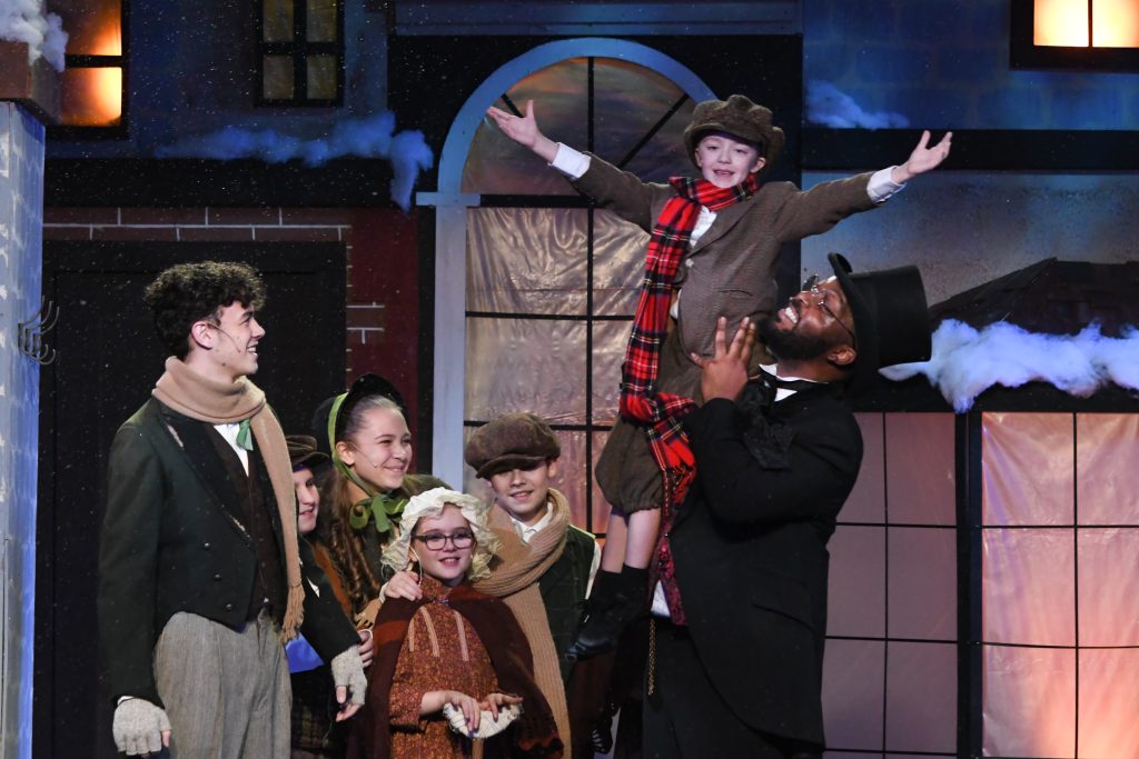 The cast of PMT's 'A Lyrical Christmas Carol' experience the magic of the season. (Photo: Matt Polk)