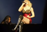 Madonna in concert in London on her current Celebrations tour accompanied on piano by daughter Mercy James. (Photo: Chris Weger and Wikipedia)