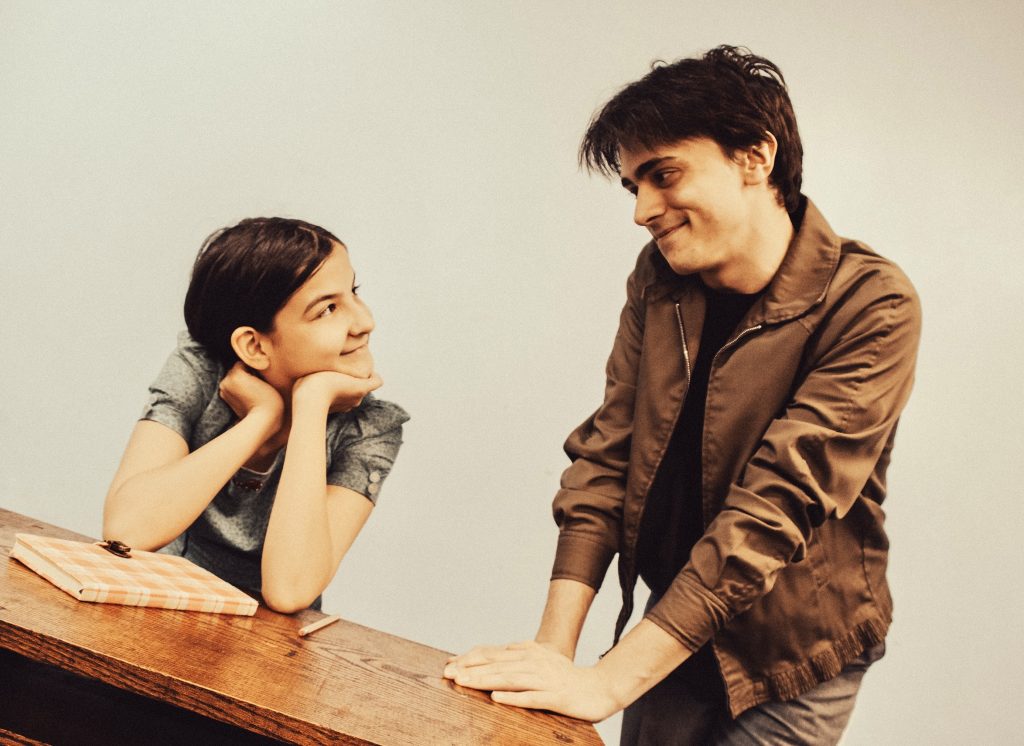 Anne Frank (Molly Frontz) shares a hopeful moment with friend Ed Silverberg (Ayden Freed) in Prime Stage Theatre's 'And Then They Came for Me ... Remembering the World of Anne Frank.' (photo: Laura Slovesko)