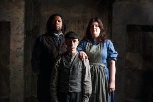 Pittsburgh Opera's 'Proving Up' features The Zegner family (l. to r.) Pa (Brandon Bell), Miles (Fran Daniel Laucerica), and Ma (Emily Richter). (Photo: David Bachman Photography for Pittsburgh Opera)