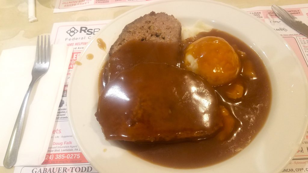 Classic meatloaf and mashed potatoes with gravy.