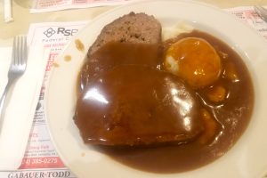 Classic meatloaf and mashed potatoes with gravy.